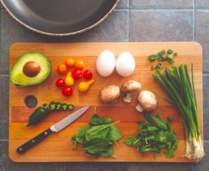 Healthy ingredients prepared on wooden cutting board
